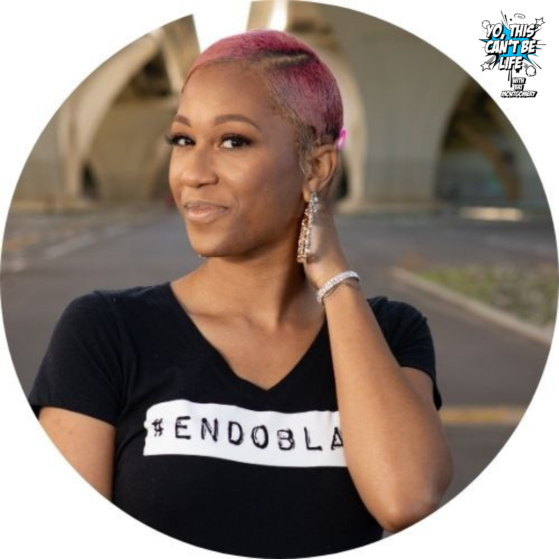 Lauren Kornegay African American woman with short pink hair wearing a Black shirt that says Endoblack in white letters